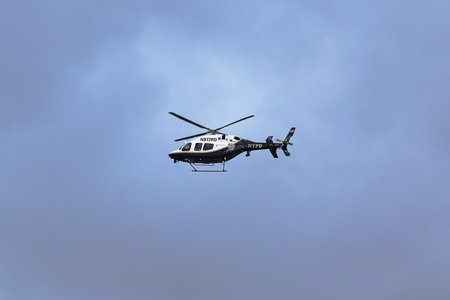 BROOKLYN, NY - NOVEMBER 2: NYPD Bell 429 helicopter in the sky providing security during New York City Marathon start on November 2, 2014 in Brooklynのeditorial素材