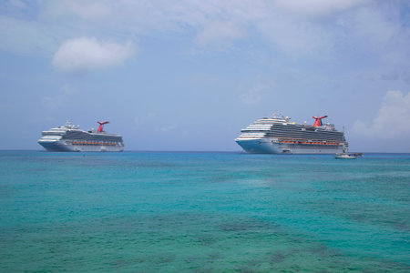GRAND CAYMAN - JUNE 12: Carnival Dream  and Carnival Glory Cruise Ships anchor at the Port of George Town, Grand Cayman on June 12, 2014.のeditorial素材