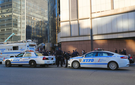 NEW YORK  - OCTOBER 12: NYPD officers providing security near Penn Station in NYC on October 12, 2014.  The New York Police Department, established in 1845, is the largest police force in USAのeditorial素材