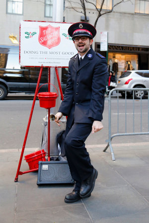 NEW YORK - DECEMBER 18: Salvation Army soldier performs for collections on December 18, 2014 in midtown Manhattan. This Christian organization is known for its charity work, operating in 126 countriesのeditorial素材