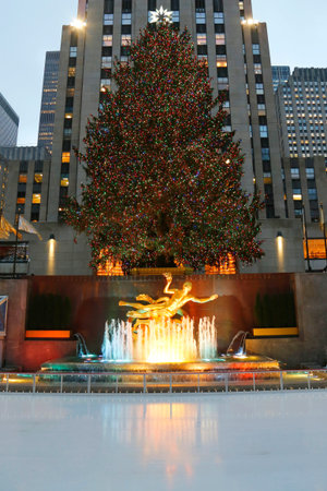 NEW YORK - DECEMBER 18: Rockefeller Center Christmas Tree and statue of Prometheus at the Lower Plaza of Rockefeller Center in Midtown Manhattan on December 18, 2014.のeditorial素材