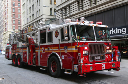 NEW YORK CITY- DECEMBER 18: FDNY Ladder Company 21 in midtown Manhattan on December 18, 2014. FDNY is the largest combined Fire and EMS provider in the worldのeditorial素材
