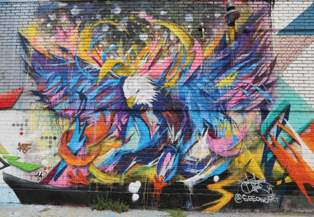 NEW YORK - JULY 24 Mural art in Astoria section in Queens on July 24, 2014. A mural is any piece of artwork painted or applied directly on a wall, ceiling or other large permanent surfaceのeditorial素材