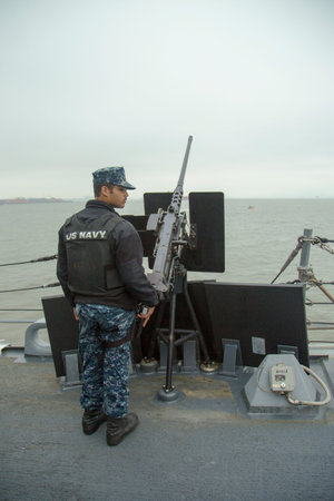 NEW YORK - MAY 22 Unidentified US Navy with .50-caliber machine gun on the deck of US guided missile...
