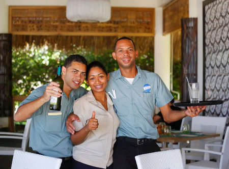 PUNTA CANA, DOMINICAN REPUBLIC -JANUARY 1, 2015: Unidentified restaurant employees at Royalton...