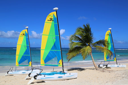 PUNTA CANA, DOMINICAN REPUBLIC - DECEMBER 31, 2014: Hobie Cat catamaran ready for tourists at Bavaro Beach in Punta Cana. The Dominican Republic is the most visited destination in the Caribbeanのeditorial素材