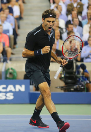 NEW YORK - September 4, 2014: Seventeen times Grand Slam champion Roger Federer during quarterfinal match at US Open 2014 against Gael Monfils at Arthur Ashe Stadium in New Yorkのeditorial素材