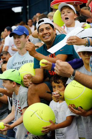 NEW YORK - AUGUST 30, 2014: Young tennis fans waiting for autographs at Billie Jean King National Tennis Center in New York. US Open is a final Grand Slam tournament of the yearのeditorial素材