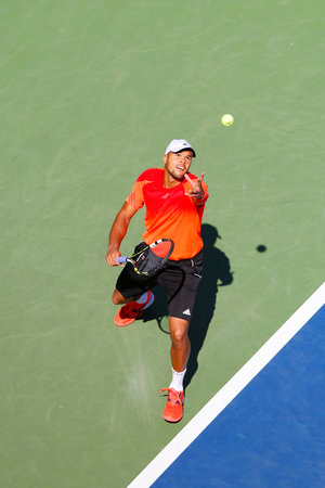 NEW YORK - AUGUST 30, 2014 Professional tennis player Jo-Wilfried Tsonga during US Open 2014 round 2 match against Aleksandr Nedovyesov at Billie Jean King National Tennis Center in New Yorkのeditorial素材