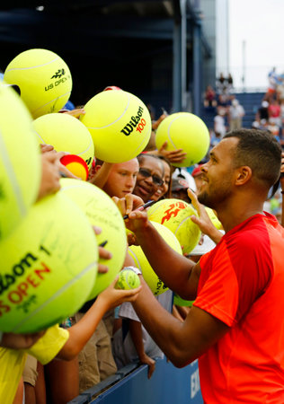 NEW YORK - AUGUST 30, 2014 Professional tennis player Jo-Wilfried Tsonga signing autographs after US Open 2014 match at Billie Jean King National Tennis Center in New Yorkのeditorial素材