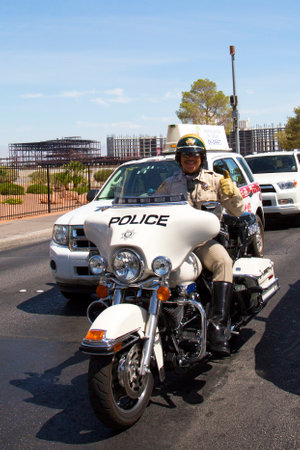 LAS VEGAS, NEVADA - MAY 9, 2014: Las Vegas Police Department officer on motorcycle on Las Vegas Strip. The Las Vegas Metropolitan Police Department is a joint city-county police forceのeditorial素材