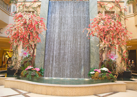 LAS VEGAS, NEVADA - MAY 9, 2014: Waterfall and spring decorations in the atrium of The Palazzo Resort Hotel Casino in Las Vegasのeditorial素材