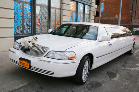 BROOKLYN, NY - NOVEMBER 9, 2014: Bridal limousine in DUMBO neighborhood in Brooklyn. The first stretch limousine was created in Fort Smith, AR around 1928 by a coach company named Armbrusterのeditorial素材