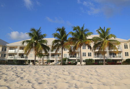 GRAND CAYMAN - JUNE 11, 2014: Luxury condominium located on the Seven Miles Beach at Grand Cayman. Seven Mile Beach is the most populated area for hotels and resorts on the islandのeditorial素材