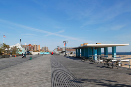 BROOKLYN, NEW YORK - MARCH 19, 2015: Famous Coney Island Boardwalk in Brooklyn. The boardwalk, built in 1923, stretches for 2.51 milesのeditorial素材