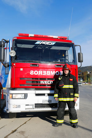 USHUAIA ARGENTINA  APRIL 2 2015: Firefighter in the front of firetruck  in Ushuaia Argentina during...