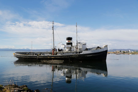 USHUAIA ARGENTINA  APRIL 2 2015: The wreck of the Saint Christopher aground in the harbor of Ushuaia. The Saint Christopher is an Americanbuilt rescue tug that served in British Royal Navy in WWIIのeditorial素材