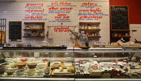 NEW YORK - MAY 7, 2015: Cheeses, cold cuts and pickles on display in Gramercy Park deliのeditorial素材