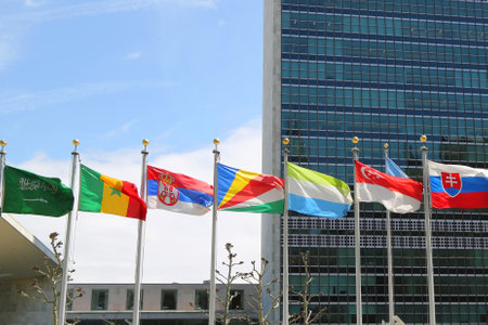 NEW YORK CITY  APRIL 30 2015: International Flags in the front of United Nations Headquarter in New Yorkのeditorial素材
