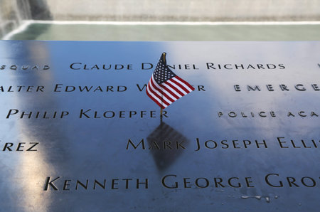 NEW YORK - JULY 11, 2015: American flag left at the National September 11 Memorial  at Ground Zero...