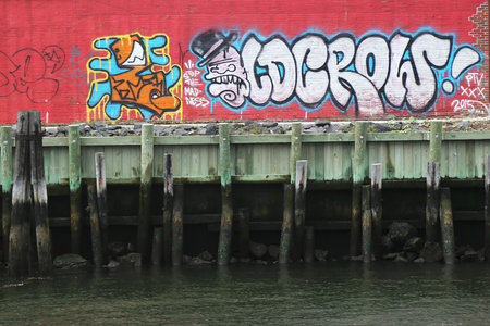 NEW YORK - JUNE 30, 2015: Mural art in Red Hook section of Brooklyn. A mural is any piece of artwork painted or applied directly on a wall, ceiling or other large permanent surfaceのeditorial素材