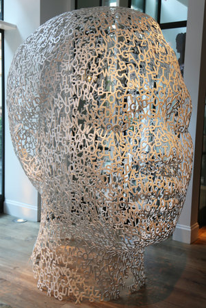 NEW YORK - JULY 17, 2015: 10-foot-tall Jaume Plensa steel sculpture of a human head made from alphabet letters on display in Manhattanのeditorial素材
