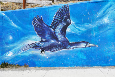 BAHIA AZUL, CHILE - APRIL 3, 2015: Mural art inspired by Patagonian history near Strait of Magellan ferry at Bahia Azul, Chileのeditorial素材