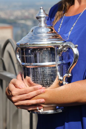 NEW YORK CITY - SEPTEMBER 13, 2015: US Open 2015 champion Flavia Pennetta holding US Open trophy on the Top of the Rock Observation Deck at Rockefeller Center in New Yorkのeditorial素材