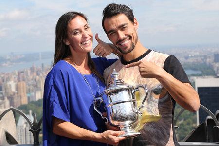 NEW YORK CITY - SEPTEMBER 13, 2015: US Open 2015 champion Flavia Pennetta and tennis player Fabio Fognini posing with US Open trophy on the Top of the Rock Observation Deck at Rockefeller Centerのeditorial素材