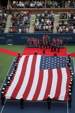 NEW YORK- SEPTEMBER 12, 2015: US Marine Corps unfurling American Flag during the opening ceremony of the US Open 2015 women s final at Billie Jean King National Tennis Center in New Yorkのeditorial素材