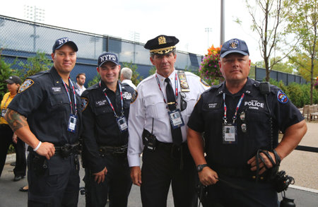 NEW YORK - SEPTEMBER 13, 2015: NYPD police officers providing security at National Tennis Center during US Open 2015 finals in New Yorkのeditorial素材