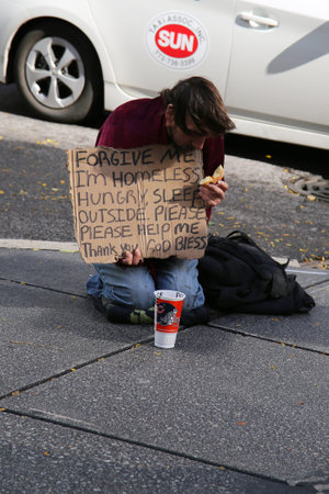 CHICAGO, ILLINOIS - OCTOBER 24, 2015: Homeless man at Michigan Avenue in downtown Chicago