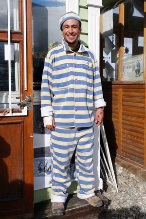 USHUAIA, ARGENTINA - APRIL 2, 2015: Tour guide dressed as prisoner in Ushuaia, Argentinaのeditorial素材