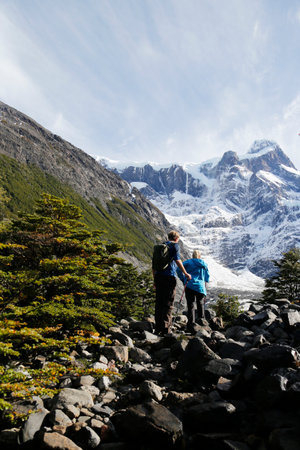 TORRES DEL PAINE, CHILE - APRIL 6, 2015: Tourists hiking in the Torres del Paine National Park, Patagonia, Chileのeditorial素材