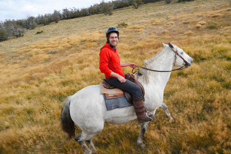 TORRES DEL PAINE, CHILE - APRIL 7, 2015: Gaucho in Torres del Paine National Park, Patagonia, Chile. Gaucho is a resident of the South American pampas, Gran Chaco, or Patagonian grasslandsのeditorial素材