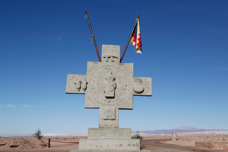 ATACAMA DESERT, CHILE - APRIL 10, 2015: Monument with flag of Aymara people at the Valle de la Luna or Moon Valley nature reserve in Atacama Desert, Chileのeditorial素材