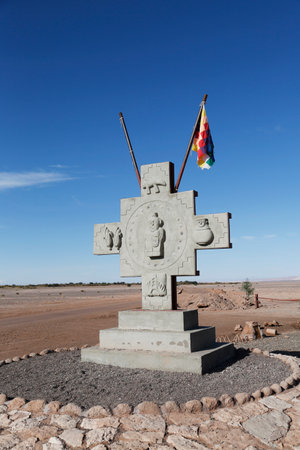ATACAMA DESERT, CHILE - APRIL 10, 2015: Monument with flag of Aymara people at the Valle de la Luna or Moon Valley nature reserve in Atacama Desert, Chileのeditorial素材
