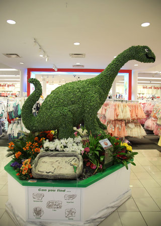 NEW YORK - MARCH 22, 2016: Dino discovery garden and flower decoration during famous Macy s Annual Flower Show in the Macy s Herald Square in midtown Manhattanのeditorial素材