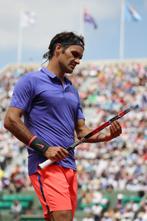 PARIS, FRANCE- MAY 27, 2015: Seventeen times Grand Slam champion Roger Federer in action during his second round match at Roland Garros 2015 in Paris, Franceのeditorial素材
