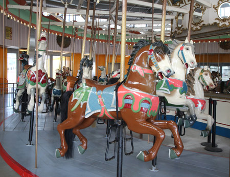BROOKLYN, NEW YORK - MAY 14, 2016: Horses on a traditional fairground B&B carousel at historic Coney Island Boardwalk in Brooklynのeditorial素材