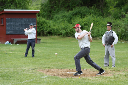 OLD BETHPAGE, NEW YORK - MAY 22, 2016: Baseball player in 19th century vintage uniform during old...