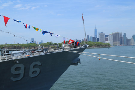 NEW YORK - MAY 26, 2016: US Navy guided-missile destroyer USS Bainbridge docked in Brooklyn Cruise Terminal during Fleet Week 2016 in New York. Manhattan Sky Line on the backgroundのeditorial素材