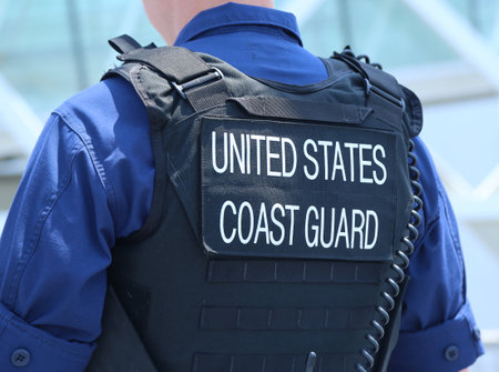 NEW YORK - MAY 26, 2016: United States Coast Guard officer providing security during Fleet Week 2016 in New York.のeditorial素材