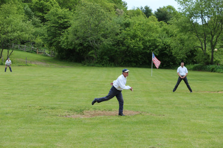 OLD BETHPAGE, NEW YORK - MAY 22, 2016: Baseball team in 19th century vintage uniform during old...