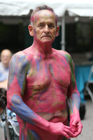 NEW YORK - JULY 9, 2016: Artists paint 100 fully nude models of all shapes and sizes during third NYC Body Painting Day in midtown Manhattan featuring artist Andy Golub in New Yorkのeditorial素材