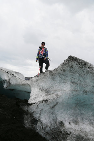 ICELAND - JULY 4, 2016: Tour guide during glacier walk at Solheimajokull glacier. Solheimajokull glacier is one of the biggest glaciers in Europe.のeditorial素材