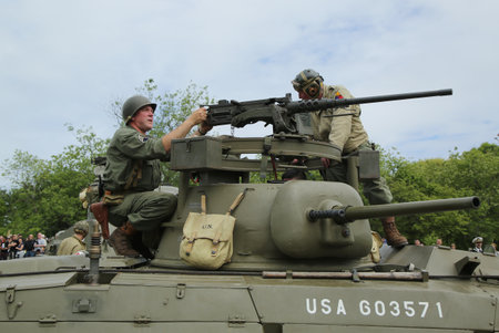 OLD BETHPAGE , NEW YORK - MAY 22, 2016: World War II Encampment participants in World War II American Army uniform in Old Bethpage, NYのeditorial素材