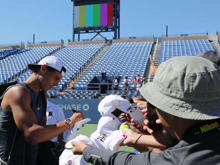 NEW YORK - AUGUST 23, 2016: Grand Slam champion Rafael Nadal of Spain signing autographs after practice for US Open 2016 at Billie Jean King National Tennis Centerのeditorial素材