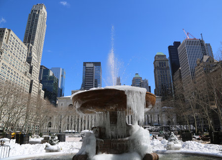 NEW YORK - MARCH 16, 2017: Frozen fountain in Bryant Park, Midtown Manhattanのeditorial素材