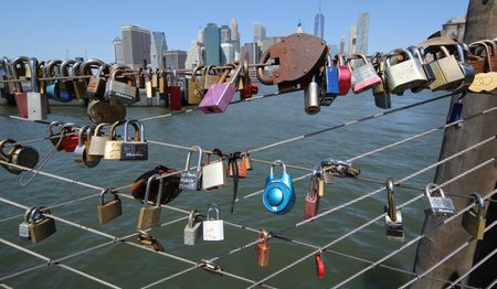 BROOKLYN, NEW YORK - JULY 19, 2016: Love locks at the Brooklyn Bridge Park in Brooklyn, New York. Ritual of affixing padlocks, as symbol of love, to bridge is spread in Europe from 2000sのeditorial素材